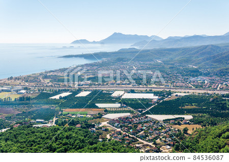 aerial view of Mediterranean coastal resort village with gardens and hotels in Camyuva, Turkey aerial view of Mediterranean coastal resort village with gardens and hotels in Camyuva, Turkey 84536087