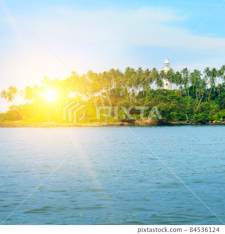 Barberyn Island and Lighthouse, turquoise ocean and sunset. Sri Lanka Barberyn Island and Lighthouse, turquoise ocean and sunset. Sri Lanka 84536124