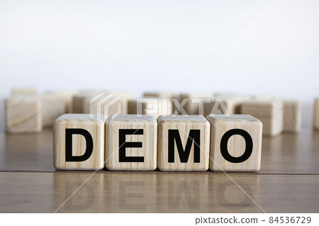 Demo symbol. Concept word 'demo' on cubes on a beautiful wooden table. White background. Business and demo concept. Copy space. Demo symbol. Concept word 'demo' on cubes on a beautiful wooden table. White background. Business and demo concept. Copy space. 84536729