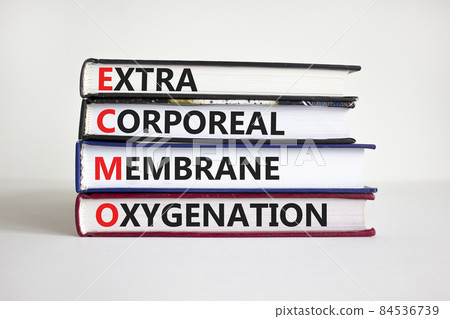 ECMO, Extra Corporeal Membrane Oxygenation symbol. Concept words 'ECMO, Extra Corporeal Membrane Oxygenation' on books on a beautiful white background. Copy space. Medical, ECMO concept. 84536739