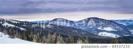 Mountain peak with snow blow by wind. Winter landscape. Cold day, with snow. 84537233
