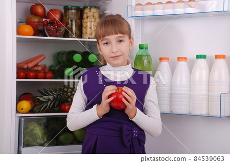 Beautiful girl near the Fridge with healthy food. Beautiful girl near the Fridge with healthy food. 84539063