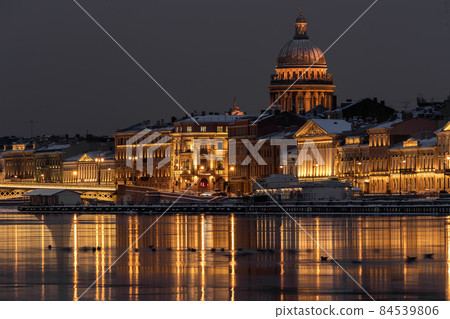 The panoramic footage of the winter night city Saint-Petersburg with picturesque reflection on water, Isaac cathedral on background, Blagoveshchensky bridge, old name is the lieutenant Schmidt The panoramic footage of the winter night city Saint-Petersburg with picturesque reflection on water, Isaac cathedral on background, Blagoveshchensky bridge, old name is the lieutenant Schmidt 84539806