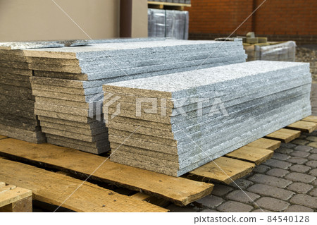 Piles of granite marble slabs. Stone sheets for decorative construction. Piles of granite marble slabs. Stone sheets for decorative construction. 84540128