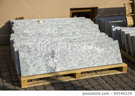 Piles of granite marble slabs. Stone sheets for decorative construction. Piles of granite marble slabs. Stone sheets for decorative construction. 84540129