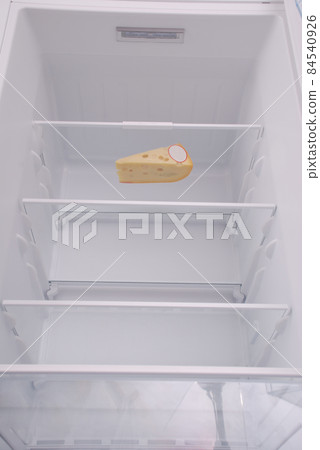 One cheese in open empty refrigerator. 84540926