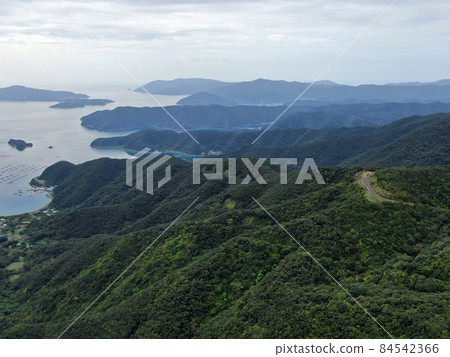 Aerial view of the mountain road from Mt. Kochi in Amami to Mt. Yuidake Aerial view of the mountain road from Mt. Kochi in Amami to Mt. Yuidake 84542366