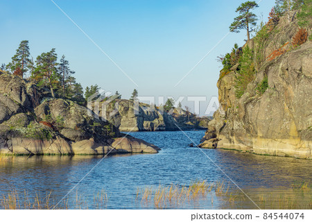 Small islands of Lake Ladoga at autumn evening. Republic of Karelia. 84544074