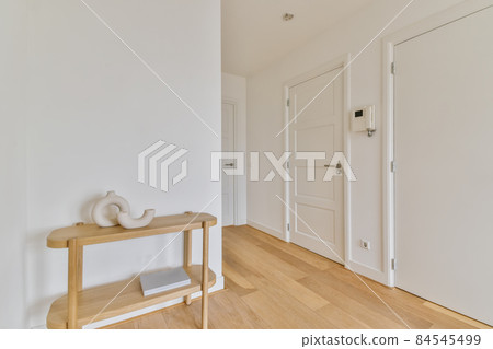 Nice lovely room with wooden parquet floor and white doors 84545499