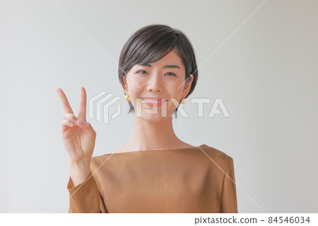 A smiling woman in the second point pose 84546034