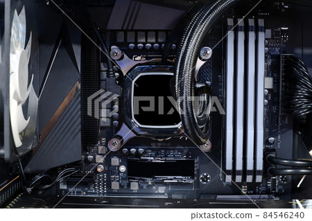 Close-up Cooling pump on CPU socket and quad channel RAM DDR4 that installed on modern mainboard 84546240