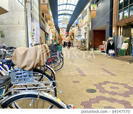 Arcade of Imaichi Shopping Street over bicycles parked in Asahi Ward, Osaka City 84547570