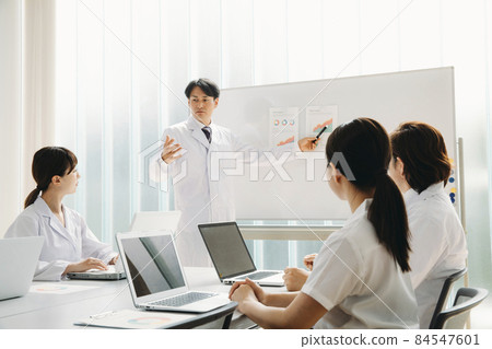 Men and women in lab coats to meet 84547601