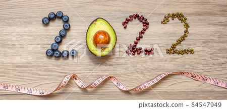 2022 Happy New Year with fruit and vegetable; Blueberries, Avocado and Bean on table. Goals, Healthy, Motivation, Resolution, Time to New Start, dieting and world food day concept 84547949