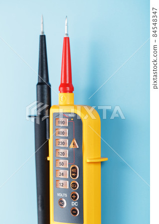 Yellow voltage indicator on a blue background Yellow voltage indicator on a blue background 84548347