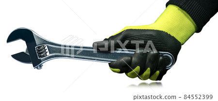 Hand with Protective Work Gloves Holding a Steel Adjustable Wrench 84552399