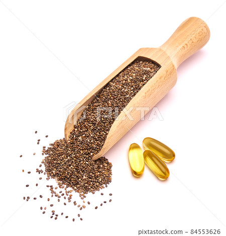 Organic natural chia seeds and wooden scoop close-up and omega pills 84553626
