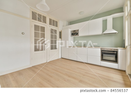 Interior of empty home kitchen with contemporary appliances 84556537