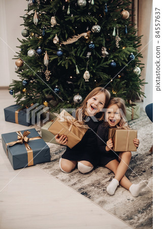 two pretty sisters rejoices together inder a two pretty sisters rejoices together inder a 84557637