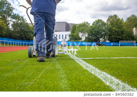 marking the boundaries of the football stadium in white marking the boundaries of the football stadium in white 84560382