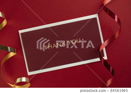 Ribbon and letter of appreciation on red background 84561965