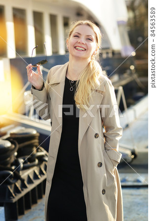 young blond slavic woman with long hair street portrait with glasses on marina boat background young blond slavic woman with long hair street portrait with glasses on marina boat background 84563589