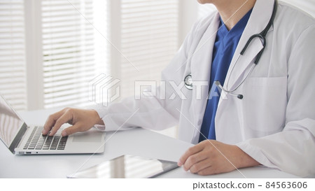 Doctor middle man white coat scrub medical examination at hand 84563606