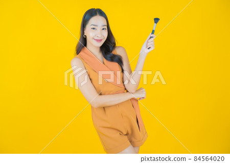 Portrait beautiful young asian woman with make up brush cosmetic 84564020