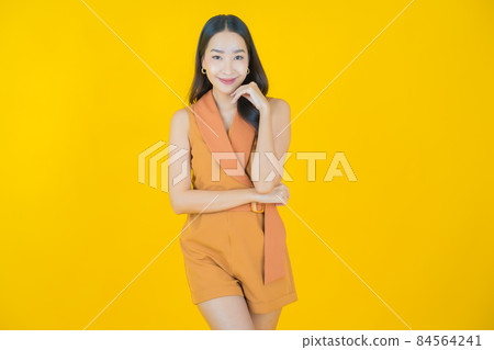Portrait beautiful young asian woman smile with action Portrait beautiful young asian woman smile with action 84564241