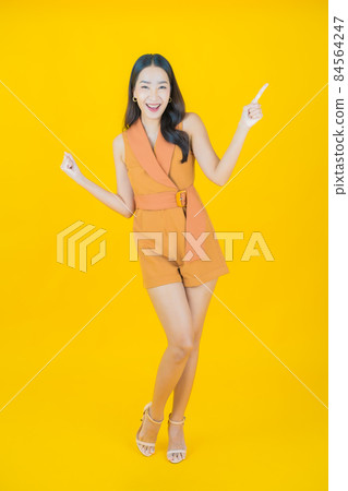 Portrait beautiful young asian woman smile with action Portrait beautiful young asian woman smile with action 84564247