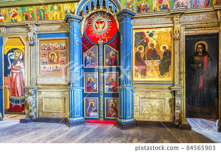 Orthodox iconostasis inside the ancient wooden Trinity Church Orthodox iconostasis inside the ancient wooden Trinity Church 84565903