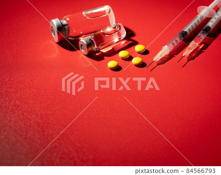 Yellow tablet and vial bottle coronavirus image 84566793