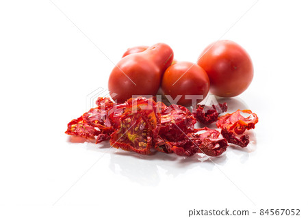 a handful of dried tomatoes and fresh tomatoes a handful of dried tomatoes and fresh tomatoes 84567052