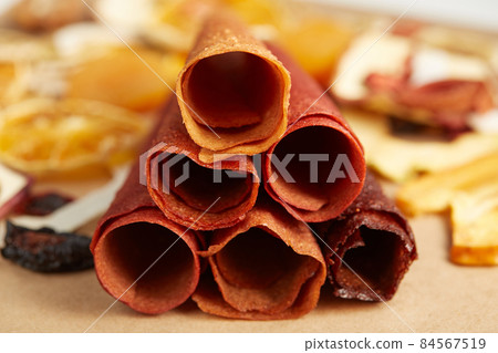 Fruit pastille with fruit and berries in rolls. Fruit pastille with fruit and berries in rolls. 84567519