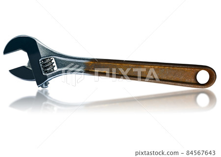 Closeup of a Stainless Steel Adjustable Wrench with Rusty Handle 84567643