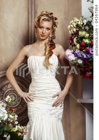 beauty young bride alone in luxury vintage interior with a lot of flowers, makeup and creative hairstyle beauty young bride alone in luxury vintage interior with a lot of flowers, makeup and creative hairstyle 84567964
