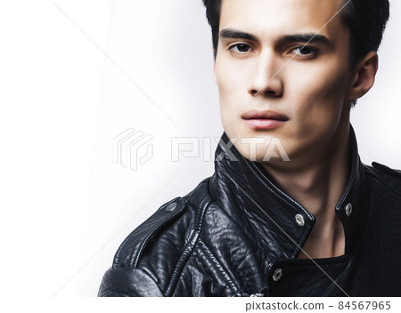 young handsome man, leather jacked on naked torso, emotional posing, white background, modern guy, lifestyle people concept 84567965