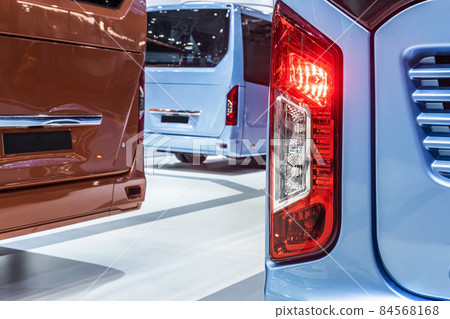 taillights of a city bus at a public transport stop taillights of a city bus at a public transport stop 84568168