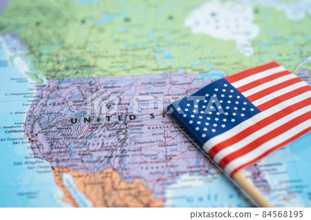 Bangkok, Thailand - February 7, 2021 USA America flag on world map background. Bangkok, Thailand - February 7, 2021 USA America flag on world map background. 84568195