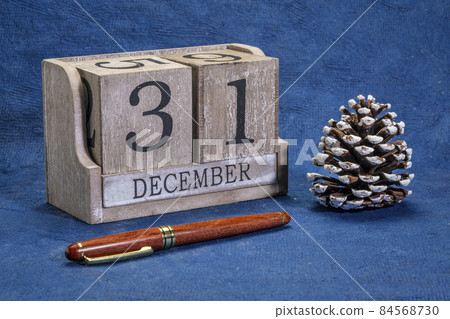 December 31 date in a rustic wood block calendar December 31 date in a rustic wood block calendar 84568730
