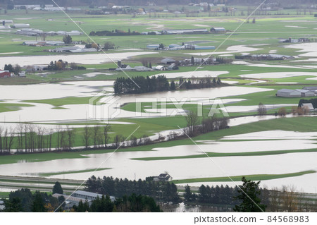 Devastating Flood Natural Disaster in the city and farmland after storm Devastating Flood Natural Disaster in the city and farmland after storm 84568983