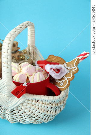 Concept of gift with Christmas basket on blue background 84569843