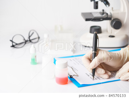 Pandemic COVID-19, Coronavirus. Unrecognizable doctor appoint prescription drugs to patients Pandemic COVID-19, Coronavirus. Unrecognizable doctor appoint prescription drugs to patients 84570133