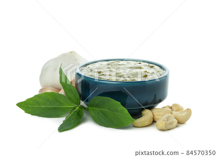 Bowl of Pesto sauce isolated on white background Bowl of Pesto sauce isolated on white background 84570350