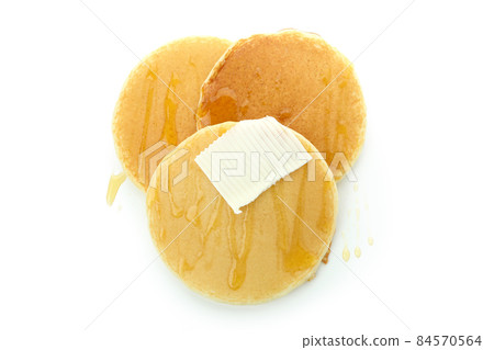 Tasty pancakes with honey and butter isolated on white background 84570564