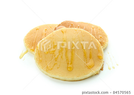 Tasty pancakes with honey isolated on white background 84570565