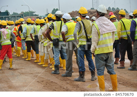 SELANGOR, MALAYSIA -FEBRUARY 13, 2015: Group of construction workers assemble at the open space in the construction site.  84570670