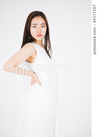A woman in a white dress A woman in a white dress 84571567