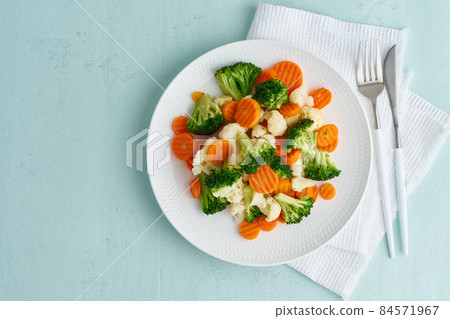 Mix of boiled vegetables. Broccoli, carrots, cauliflower. Steamed vegetables for dietary 84571967