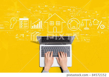 Real estate theme with person using laptop Real estate theme with person using laptop 84572152